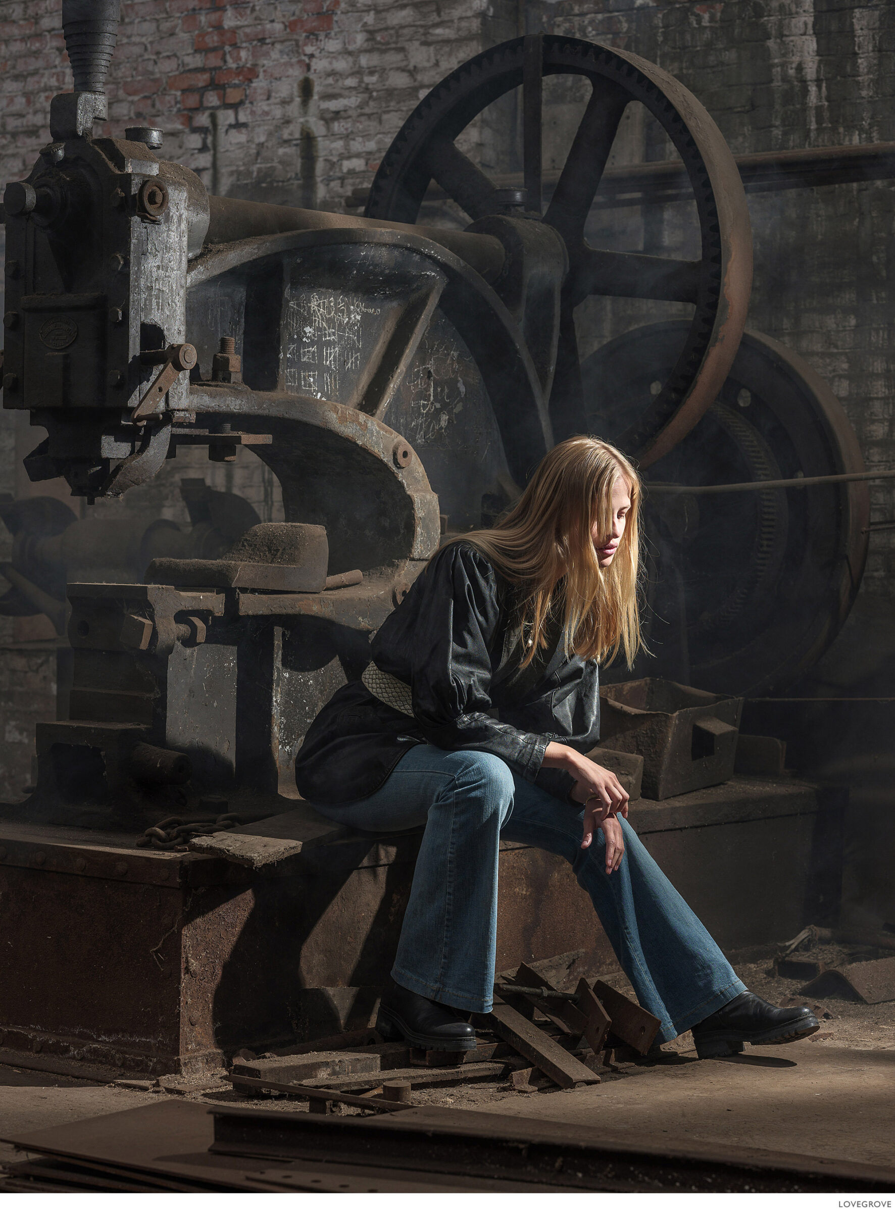 stomp-set-001 Jolien sits on a machine in this industrial age workshop