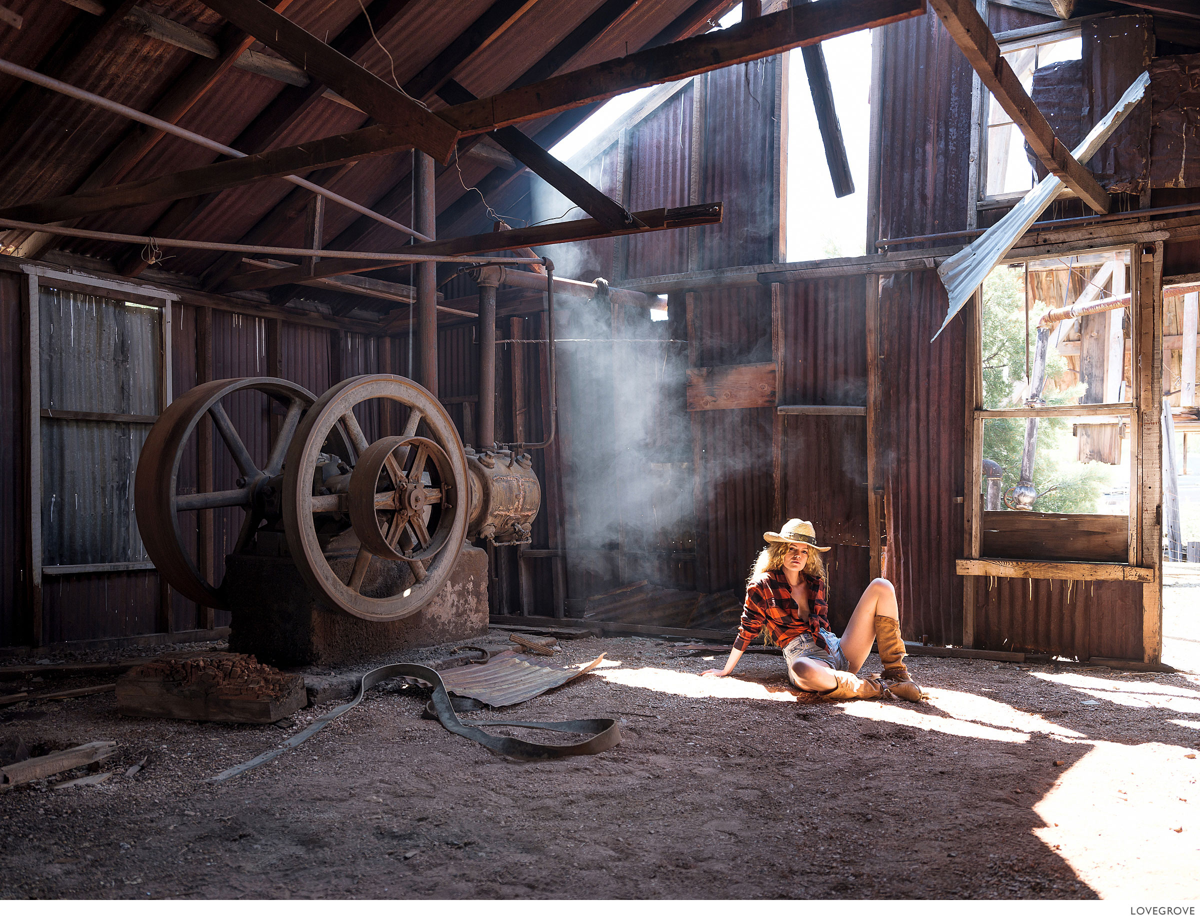 Deserts-and-Gold-Dust-050 A girl sits in an abonded ore crushing mill