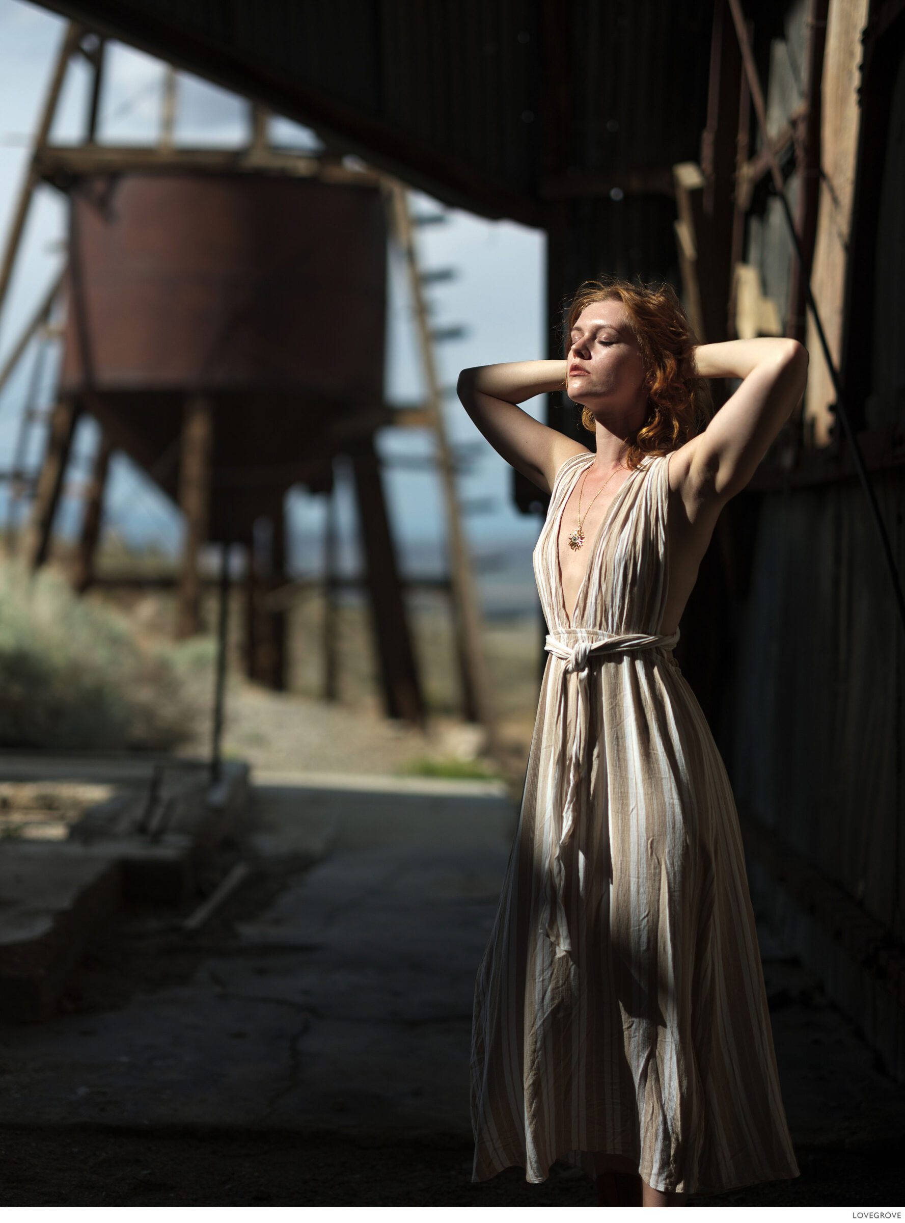 Deserts-and-Gold-Dust-263 A girl sits in an abonded ore crushing mill